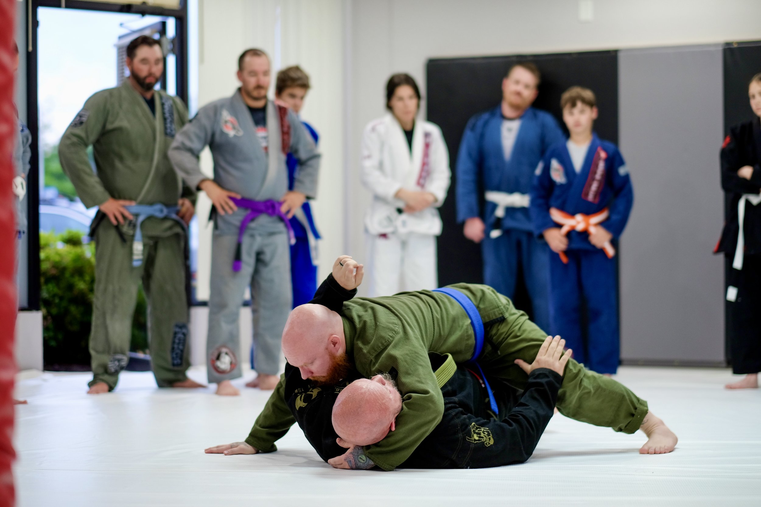 Students rolling on the mats at Ronin BJJ